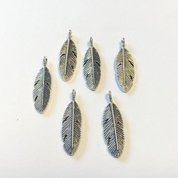 Metal charms feathers...